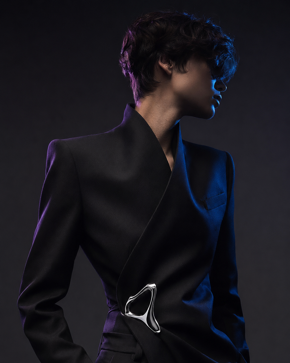 Fashion-tech virtual talent editorial in black tailoring